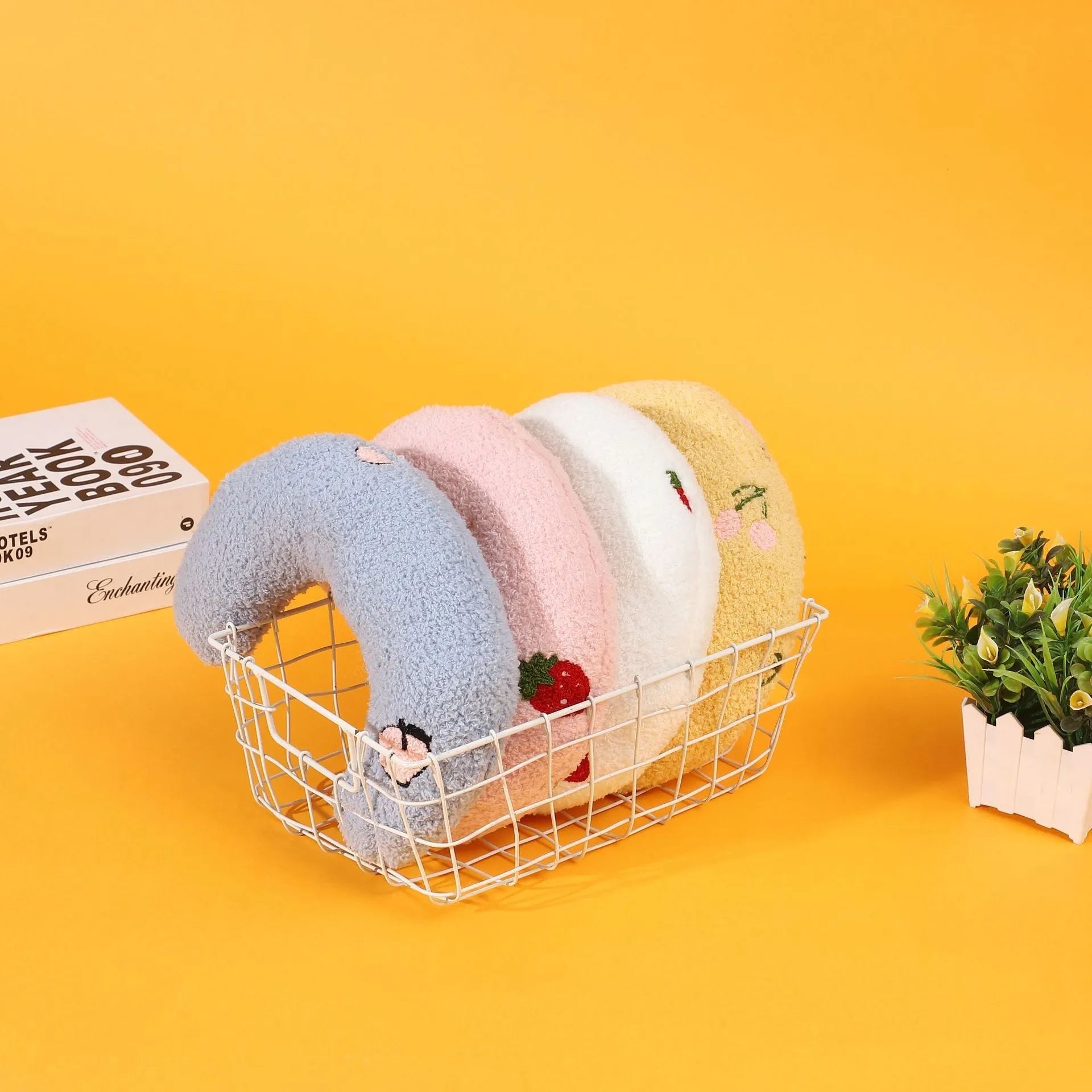 Colourful half moon U-shaped cloth pillow for cats and small dogs to sleep on.