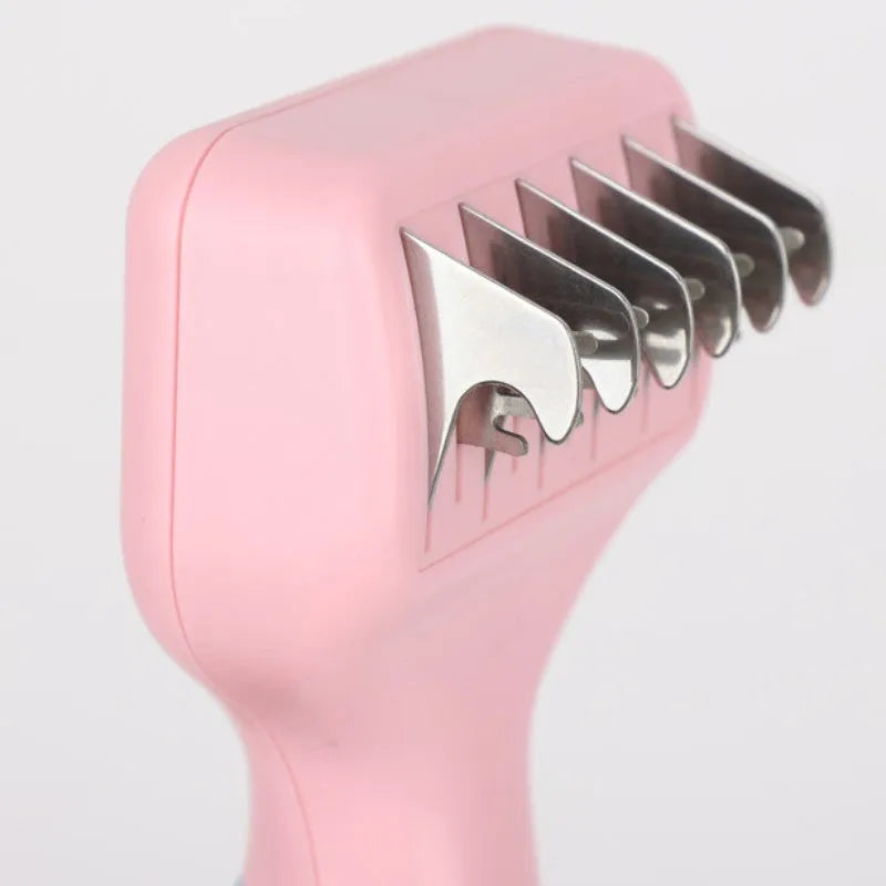 Pink stainless steel dog comb with built-in knot knife and massage teeth for pet grooming.