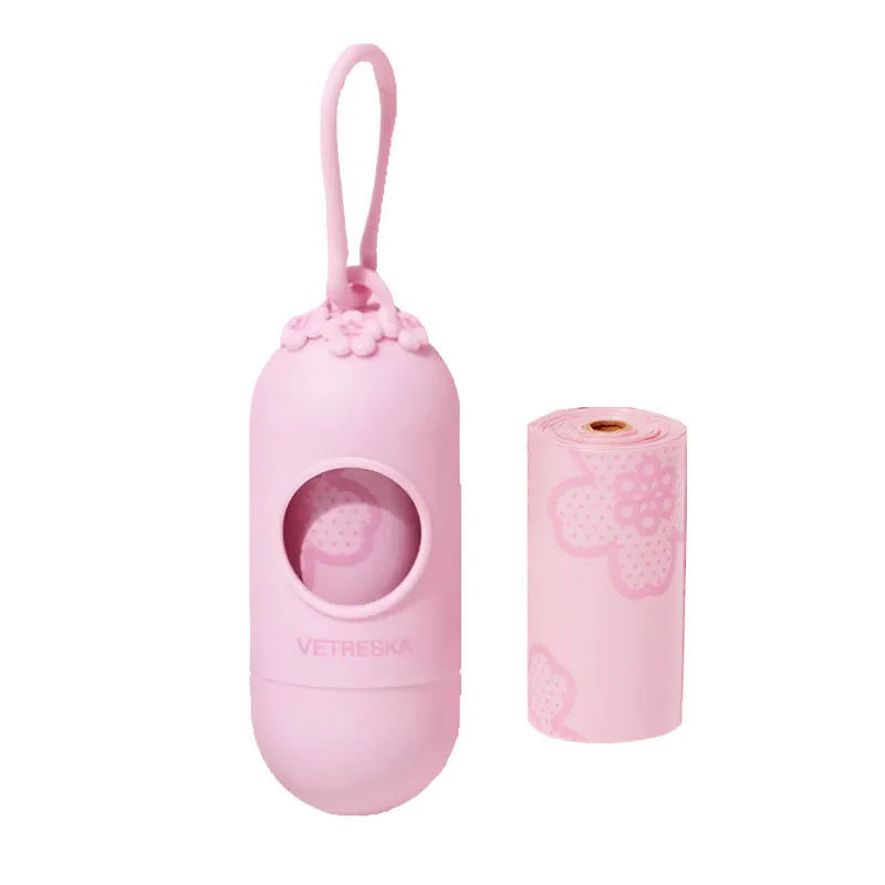 Portable dog waste bag dispenser capsule with scented inner bags attached to keychain