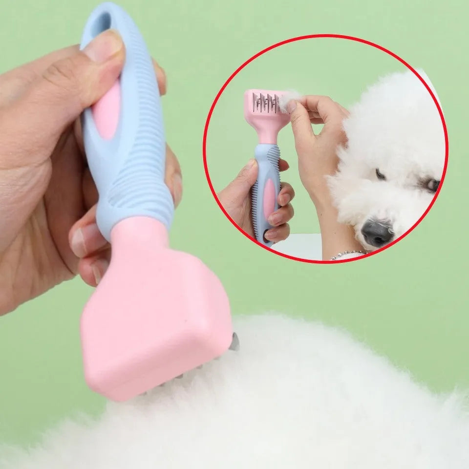 Pink stainless steel dog comb with built-in knot knife and massage teeth for pet grooming.