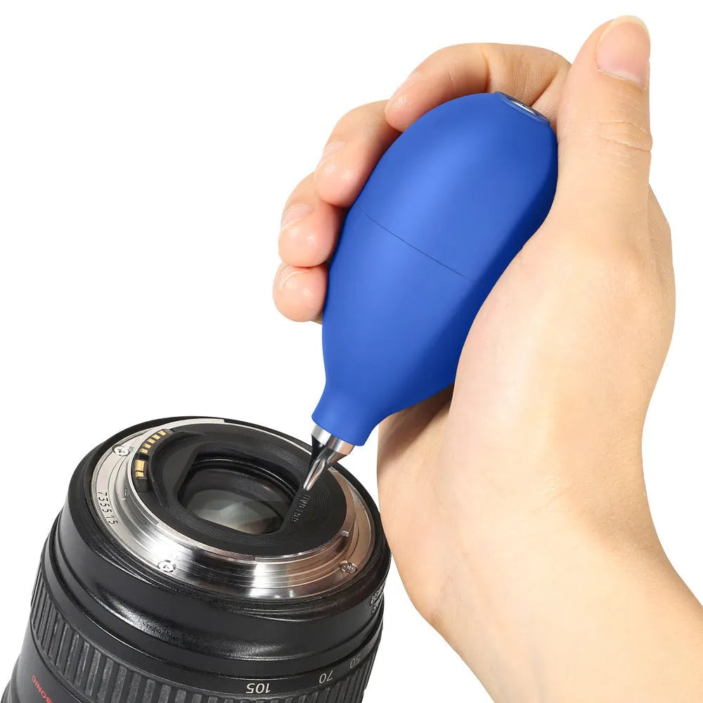 Blue and black rubber dust removal ball for cleaning cameras, phones, and clocks.