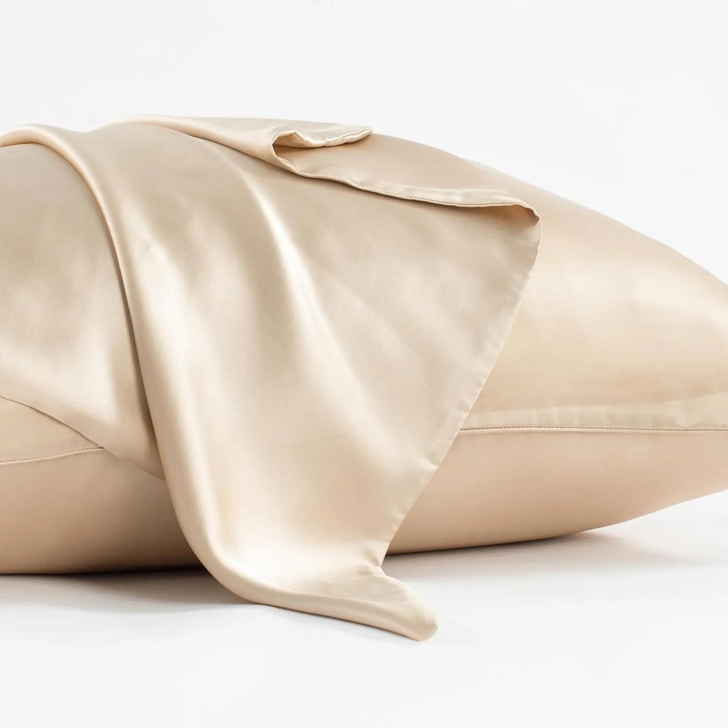Dark gray 19 M silk envelope pillowcase with envelope closure on a bed.
