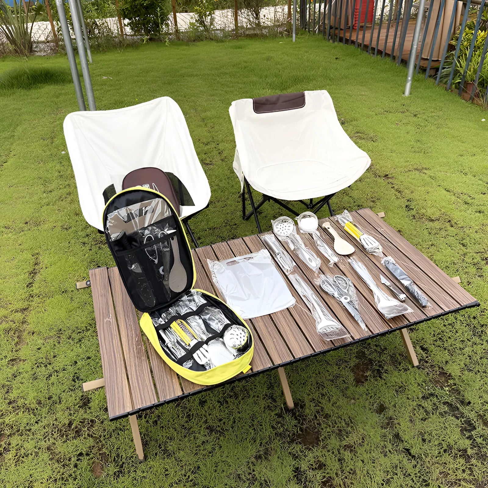 12-piece stainless steel picnic cutlery set inside a khaki coloured portable storage bag.