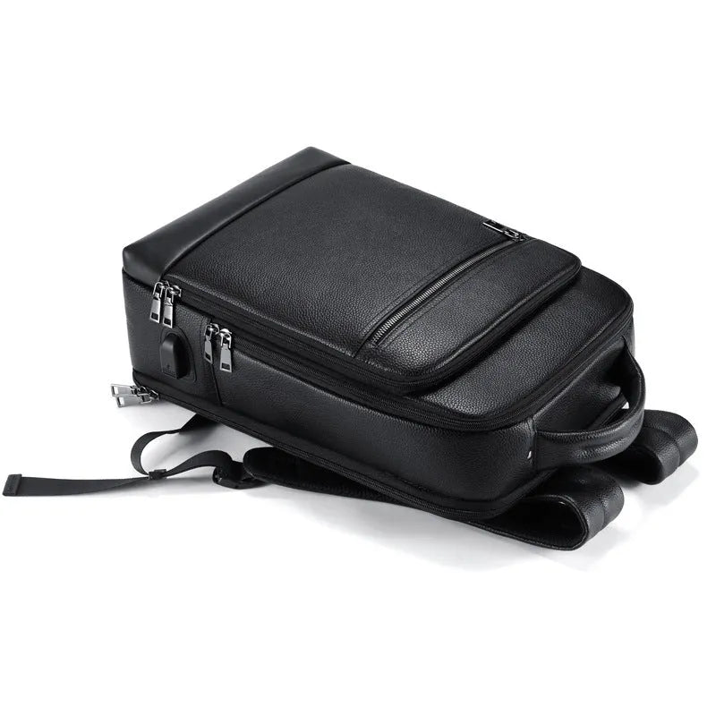 Black genuine leather men's business laptop backpack with curved shoulder straps.