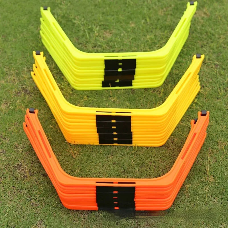 Set of six yellow, green, and orange foldable hexagonal football agility training rings laid flat.