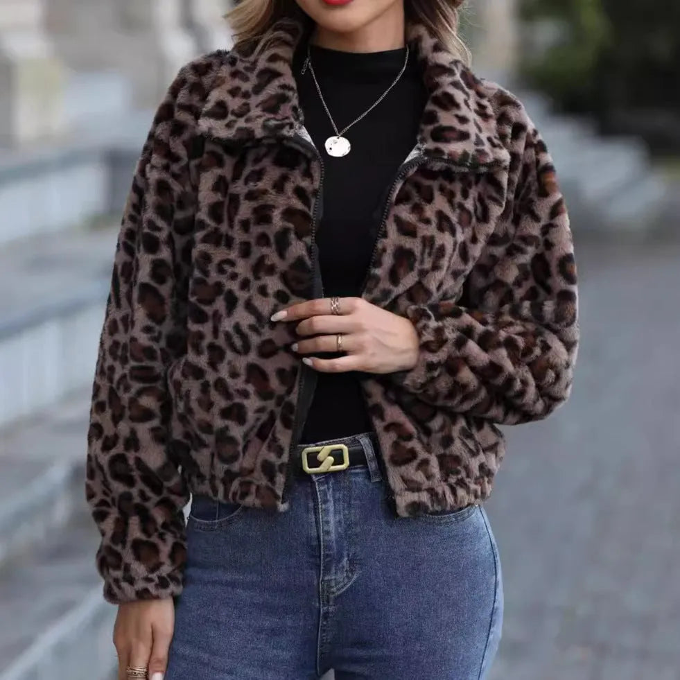 Women's loose leopard print plush coat with front zipper and raglan sleeves on a hanger.
