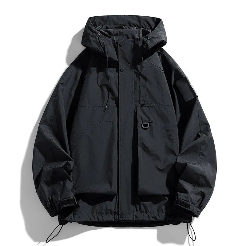 A man wearing a black windproof waterproof hooded jacket made from polyester blend fabric.