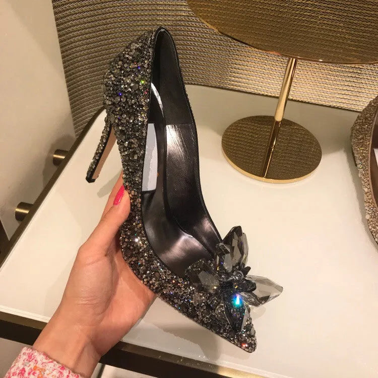 Women's gold stiletto high heels with rhinestone decoration on pointed toe