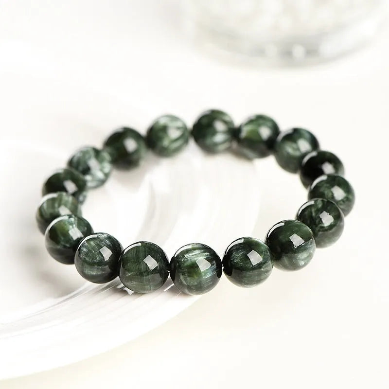 Natural green Grade 7A Dragon Crystal bracelet with 8-9mm round beads and a Ruyi design element.