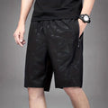 Men's loose fit printed sports shorts with elastic waistband in black, grey, or blue colours