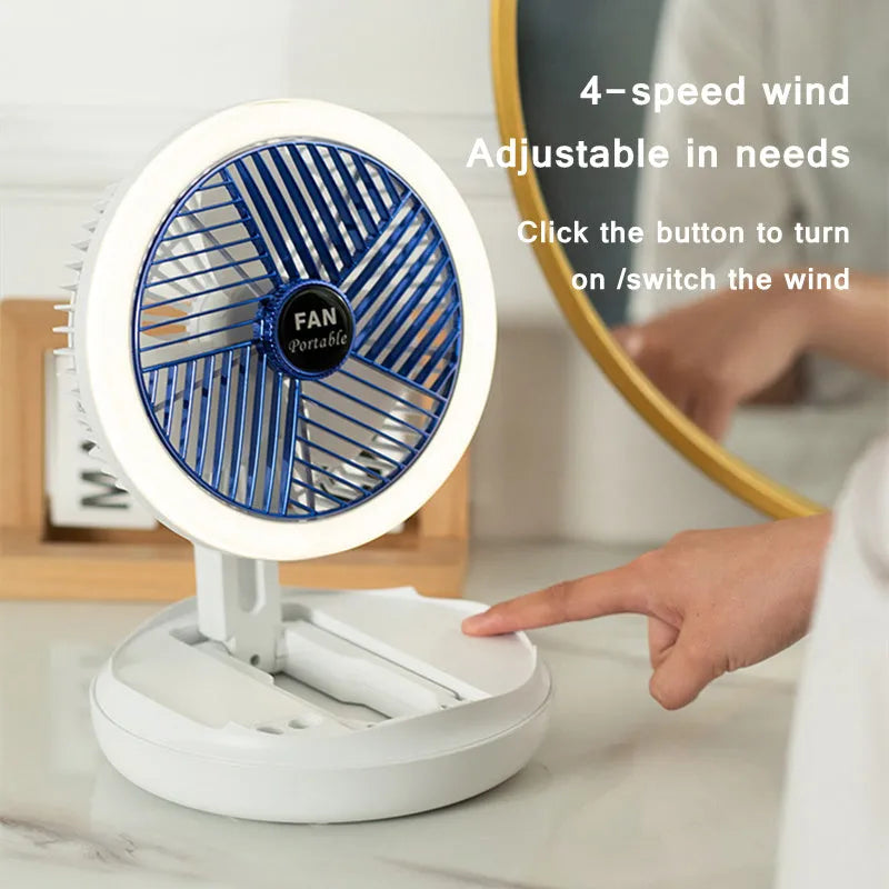Blue USB foldable table fan with LED night light, pen holder, and four speed settings on a desk
