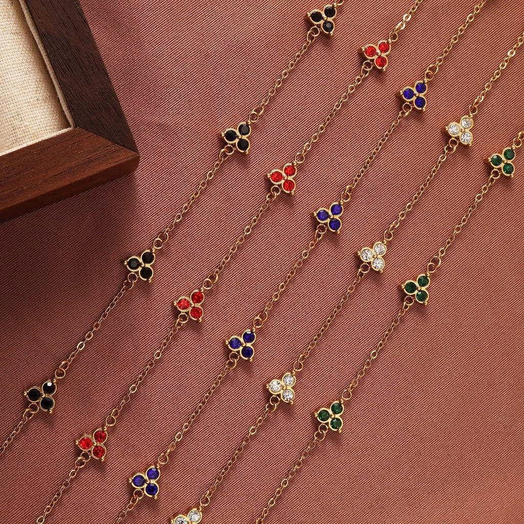 Stainless steel women's bracelet with three triangular zircon stones in a choice of colours and metal finishes.