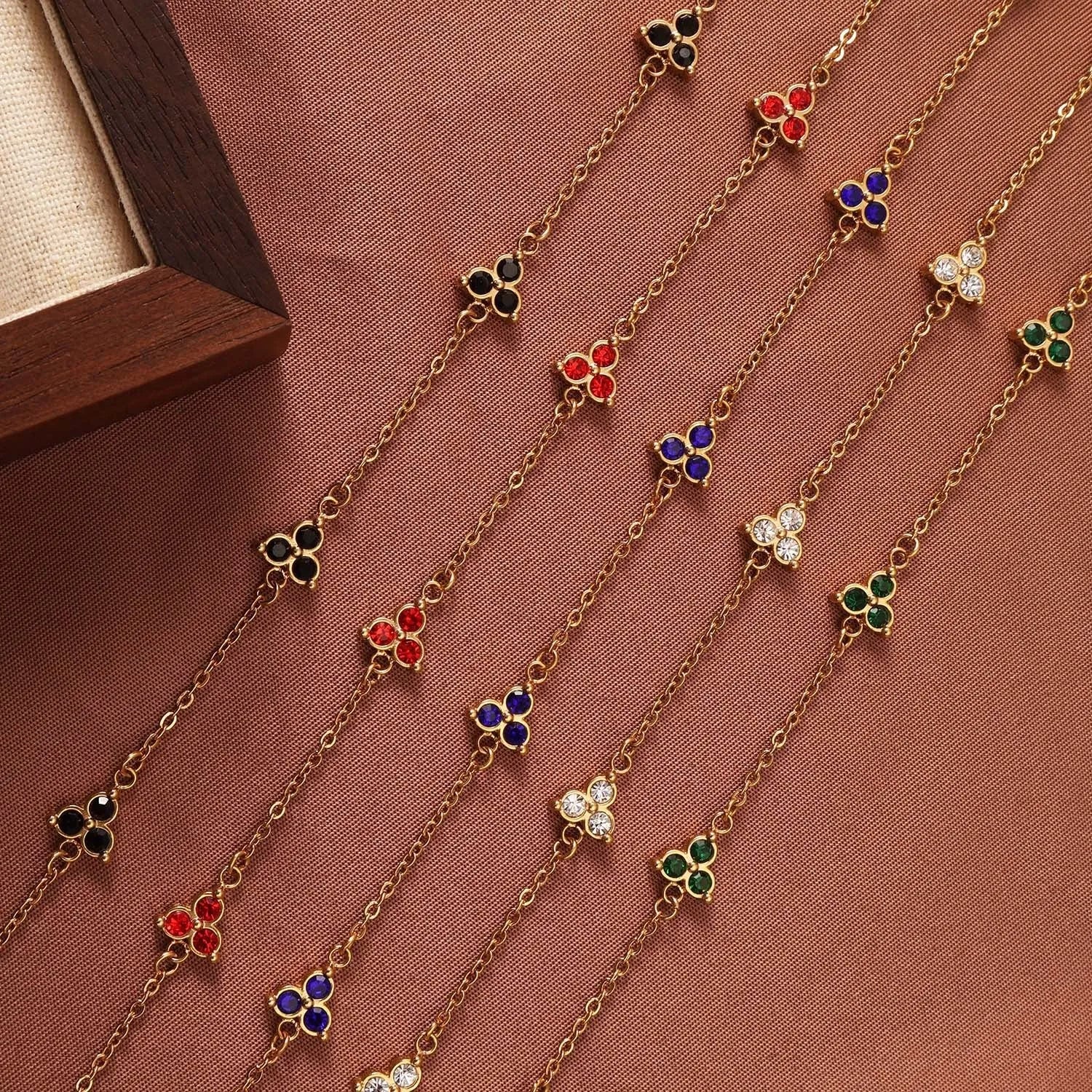 Stainless steel women's bracelet with three triangular zircon stones in a choice of colours and metal finishes.