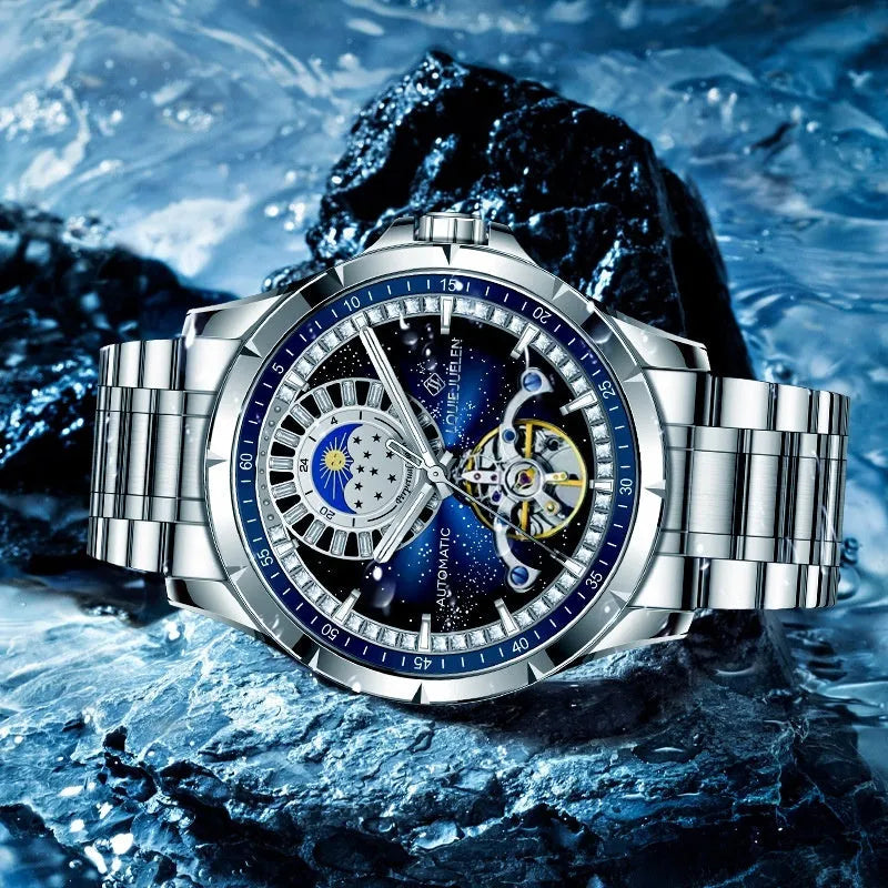 Silver alloy automatic mechanical watch with blue dial and stainless steel strap on wrist