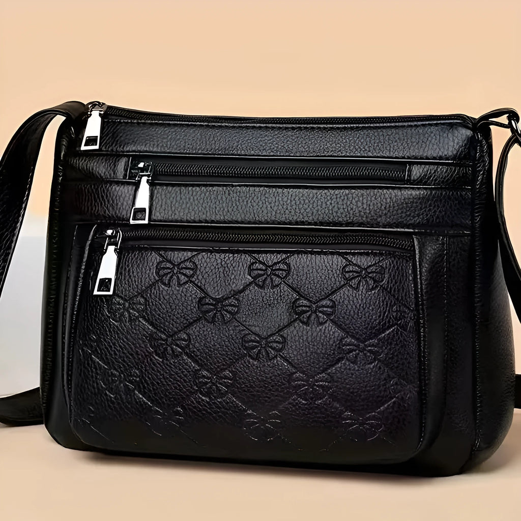 Women's butterfly black PU leather messenger bag with adjustable strap and phone pocket