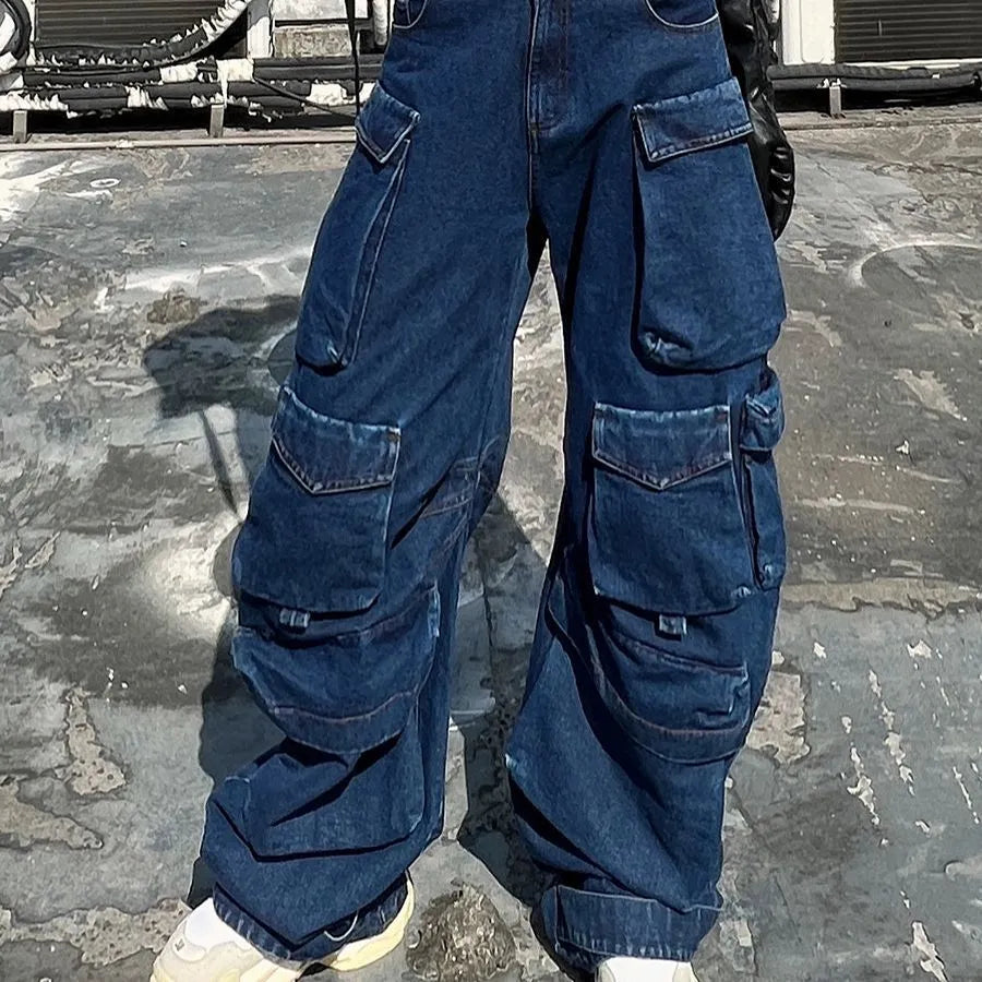 Women's dark blue distressed wide-leg high waist jeans with multiple pockets on a mannequin.