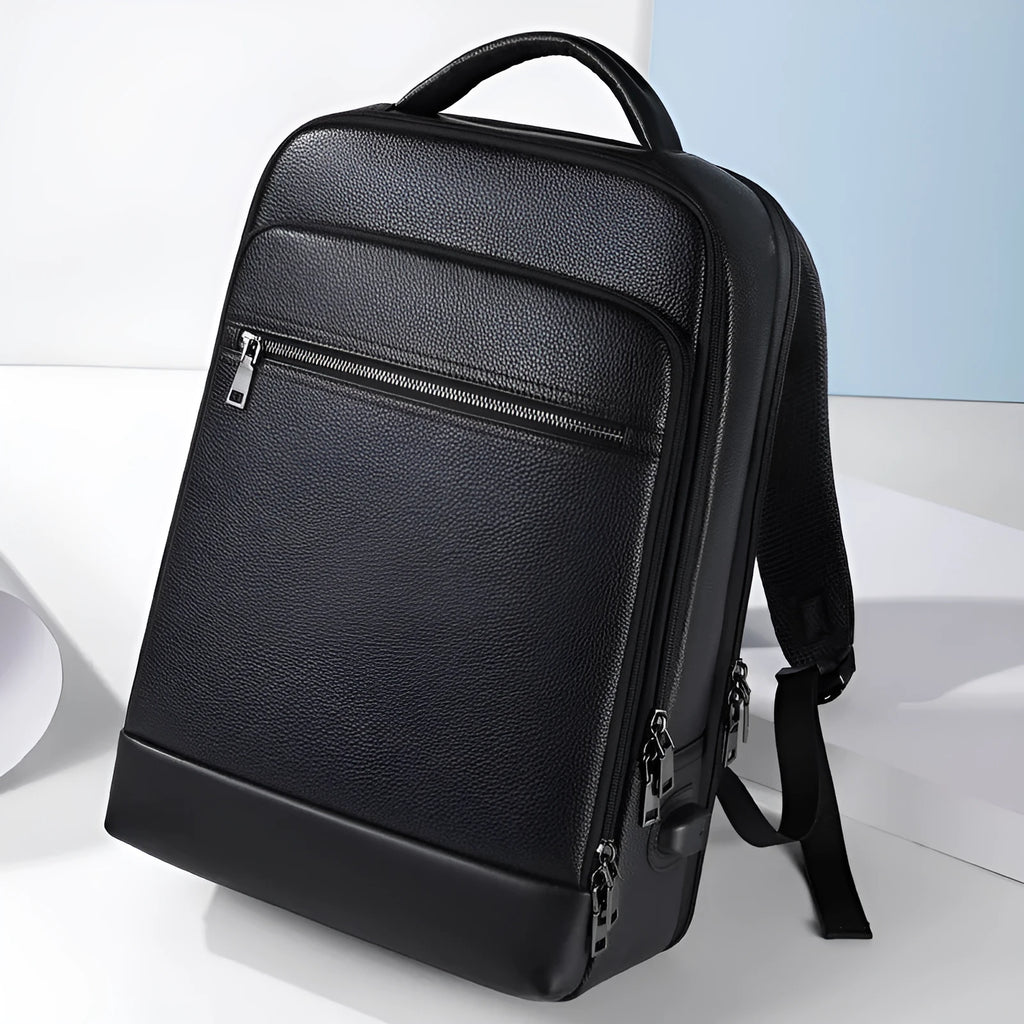Black genuine leather men's business laptop backpack with curved shoulder straps.