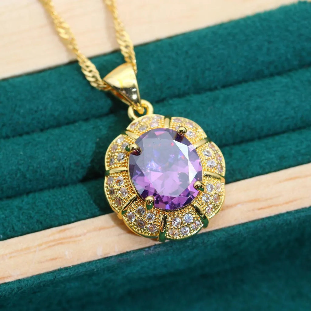 18k gold plated jewellery set with cubic zirconia stones, showing necklace, earrings, bracelet, and ring.