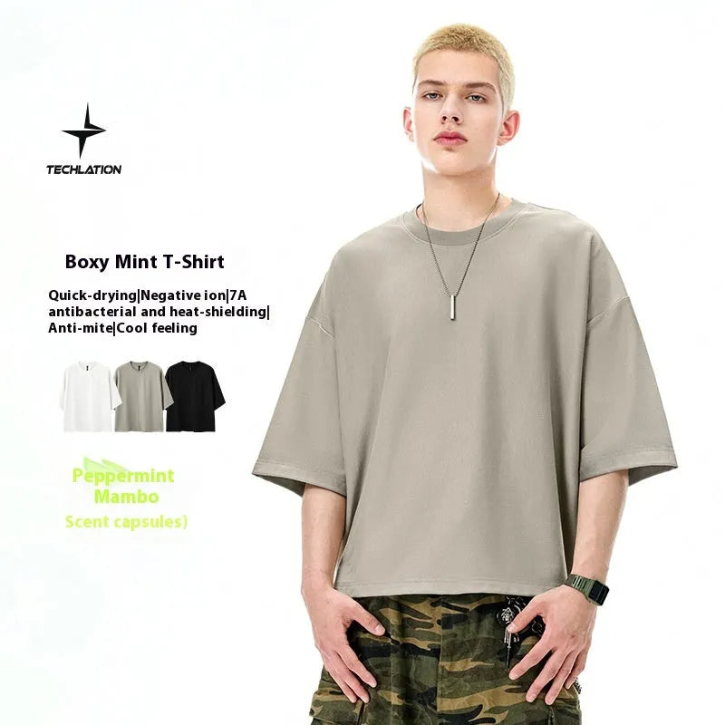 Men's sand grey loose-fit short sleeve t-shirt on a hanger.