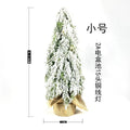 Small 24-inch plastic Christmas tree with PE snow sprayer effects and integrated lighting