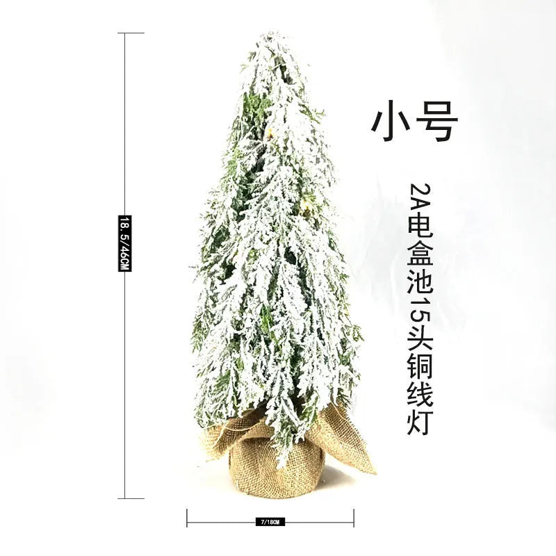 Small 24-inch plastic Christmas tree with PE snow sprayer effects and integrated lighting
