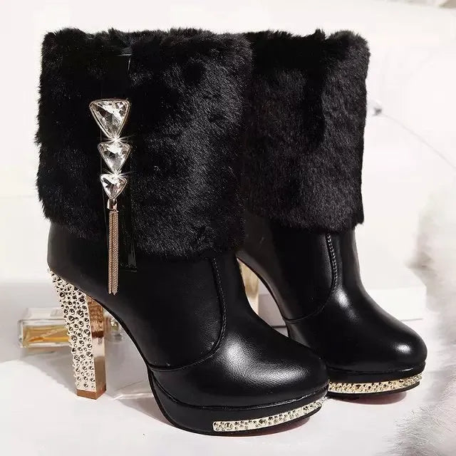 Women's black ankle boot with a chunky high heel on a white background, showing the artificial PU leather upper.