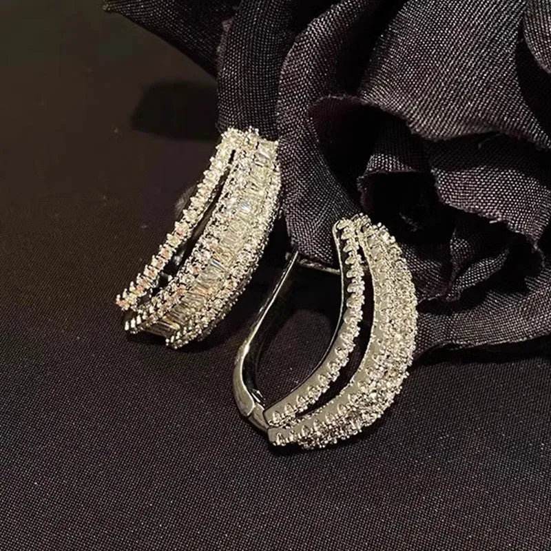 Geometric stud earrings with white gold colour finish and zircon inlaid decoration