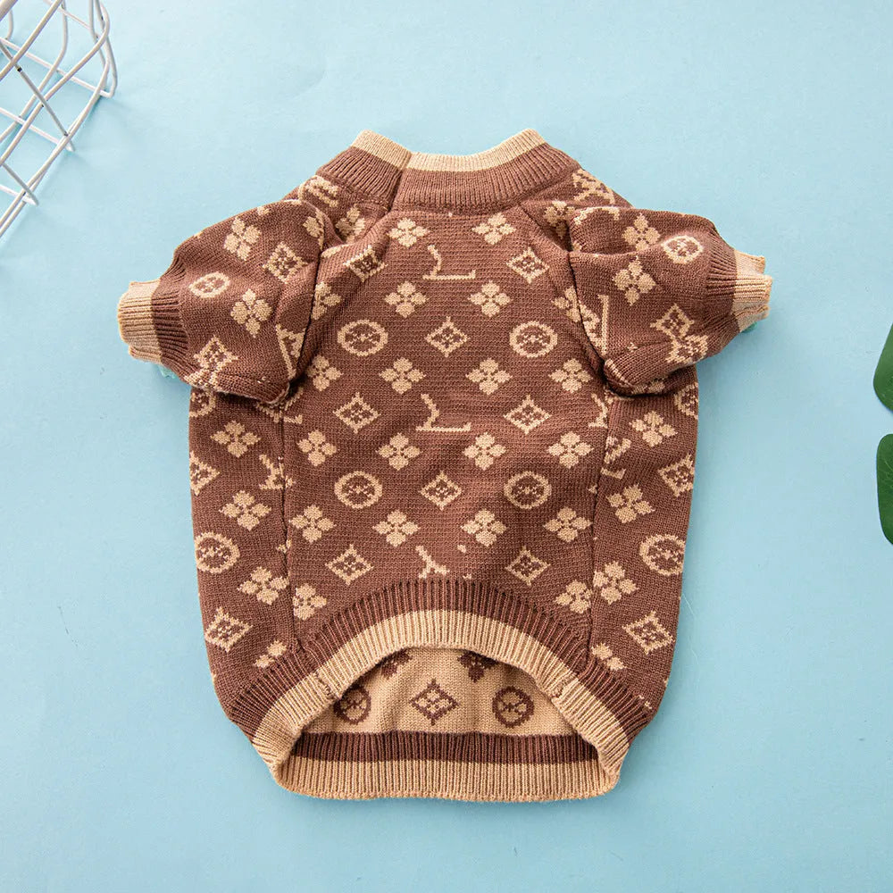 Wool knitted dog sweater in a two-tone colour on a small dog.