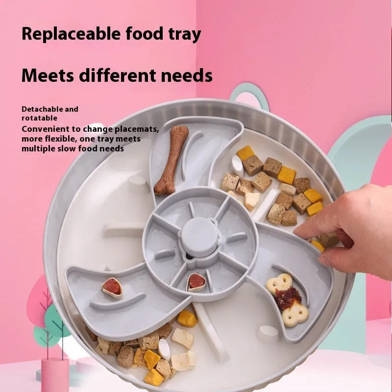 Rotating pet slow feeder bowl with silicone anti-choke pad in blue, showing game board texture.