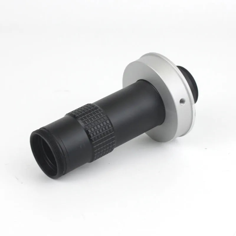 Black industrial monocular camera lens for 0.1-1.3X magnification with 60-300mm working distance.