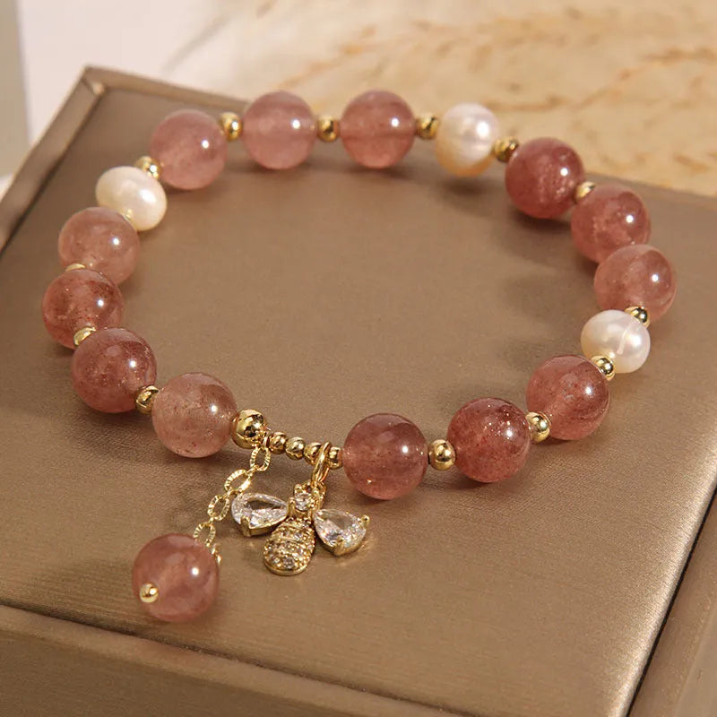 Pink strawberry quartz and white freshwater pearl bracelet with bee charm and zircon accents