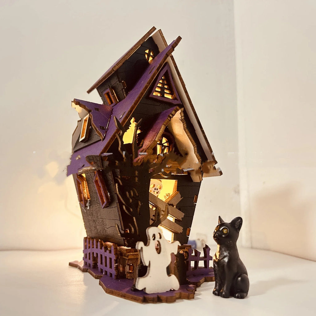 Unpainted wooden haunted house Halloween decoration measuring 14cm wide by 19cm tall