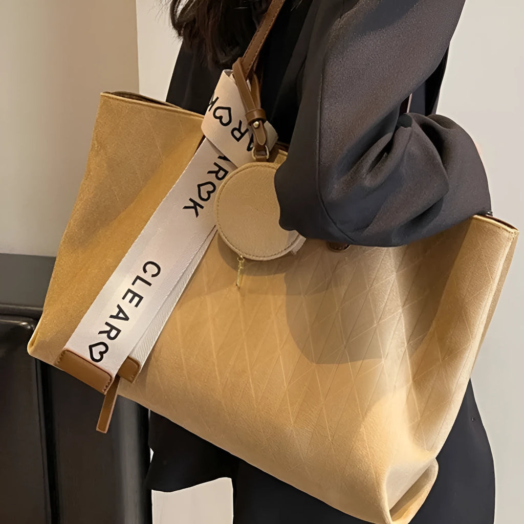 Large soft polyester shoulder bag in horizontal square shape with outer pocket, shown in light khaki colour.