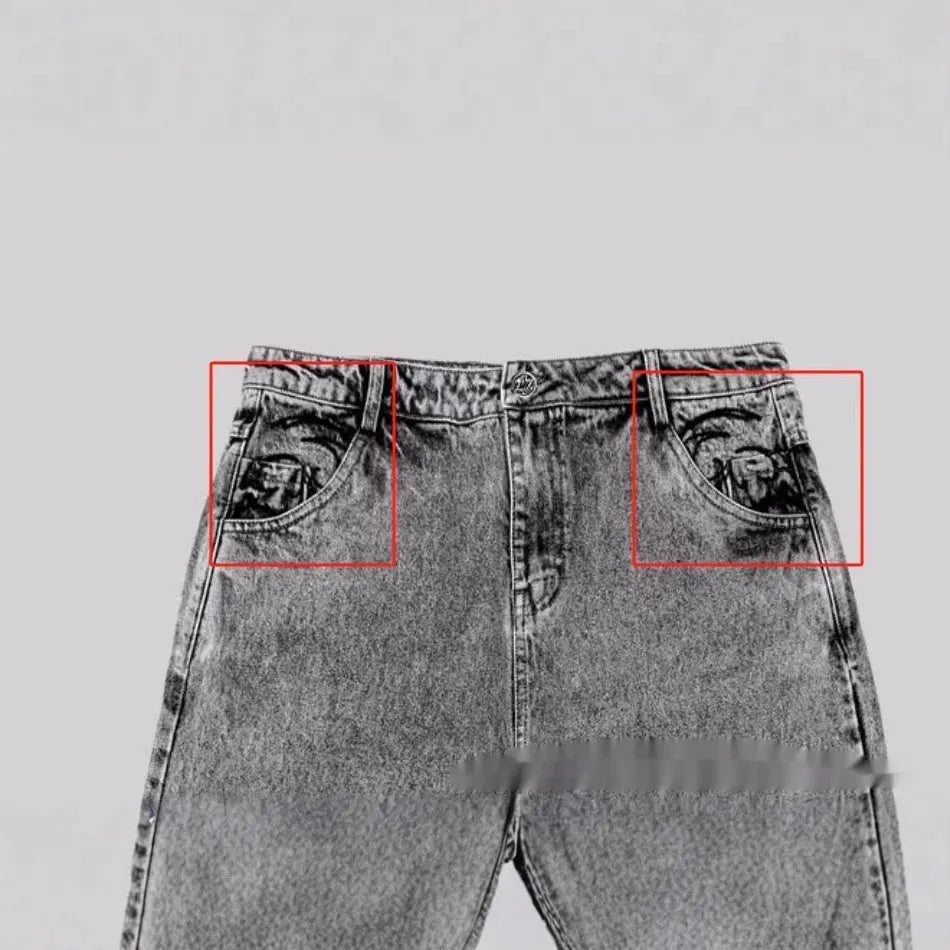 Grey loose fit straight-leg denim trousers for men and women on a neutral background
