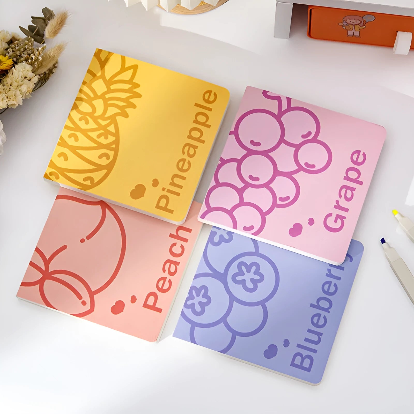 Square notebook with colour embossed fruity design cover, shown with 80g paper pages.