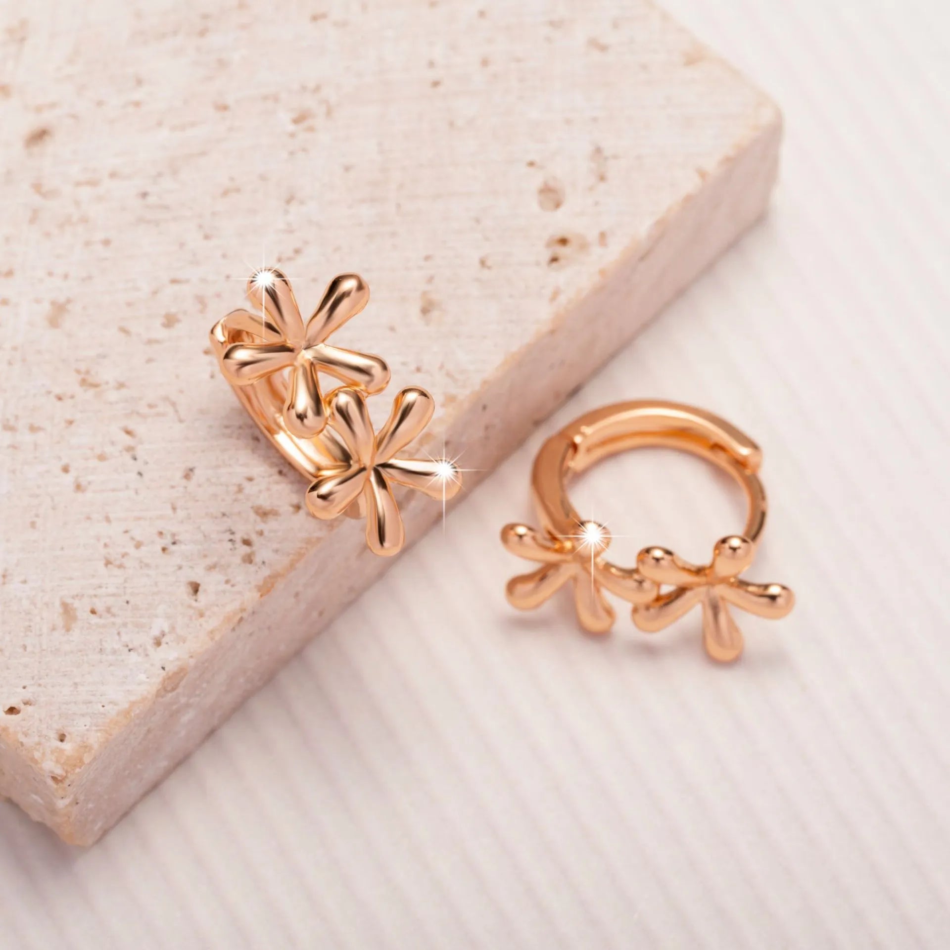 Rose gold electroplated earrings with circular waterdrop flower design