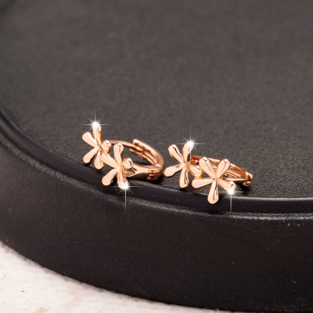 Rose gold electroplated earrings with circular waterdrop flower design