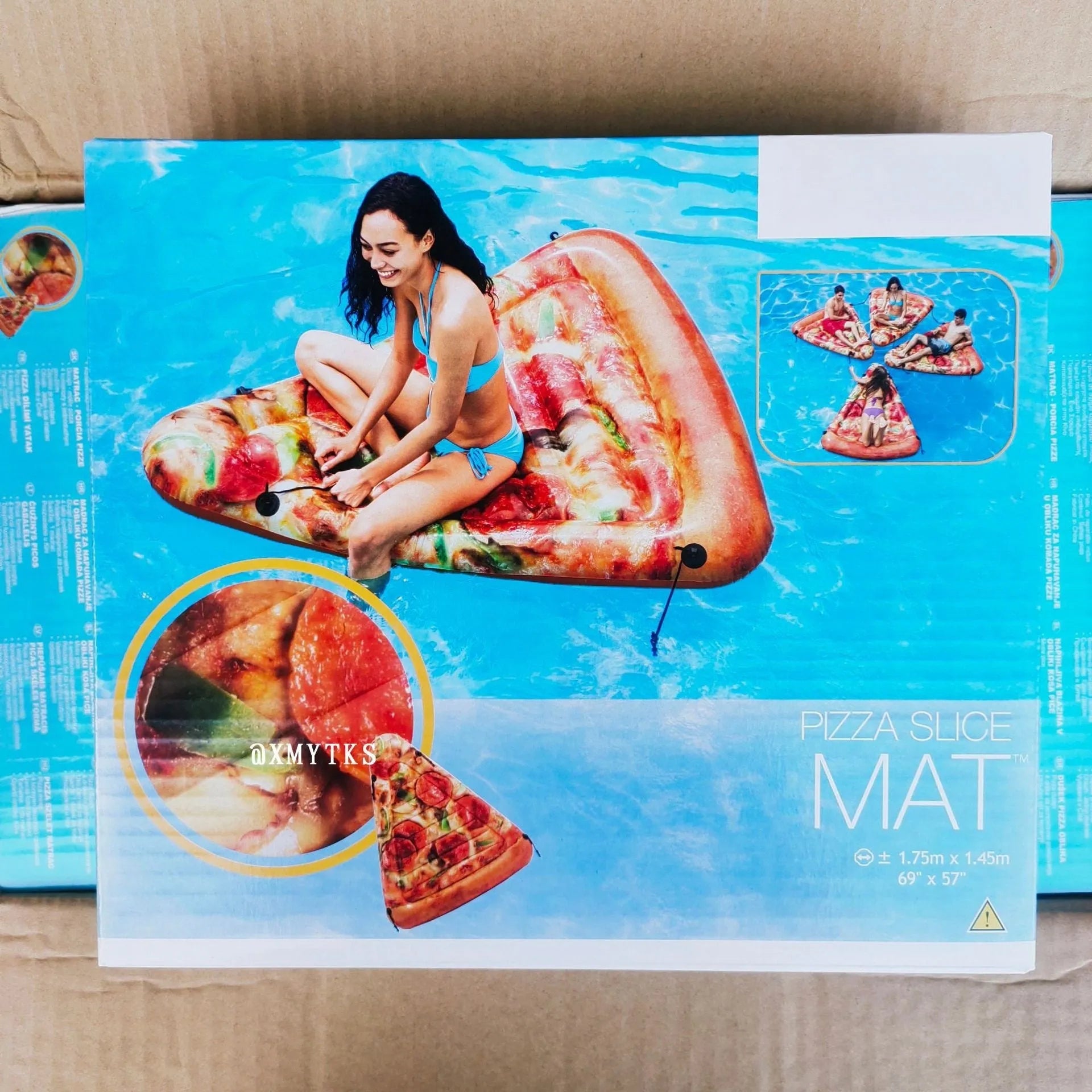 Colourful pizza inflatable surfboard recliner floating in pool