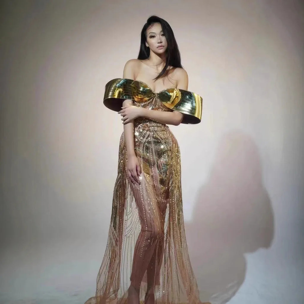 Gold strapless sequined long dress with tulle skirt and side slit detail.