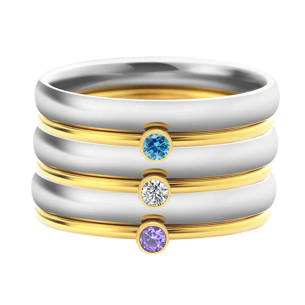 December birthstone engraved ring in titanium steel with gold accents and a geometry shape.