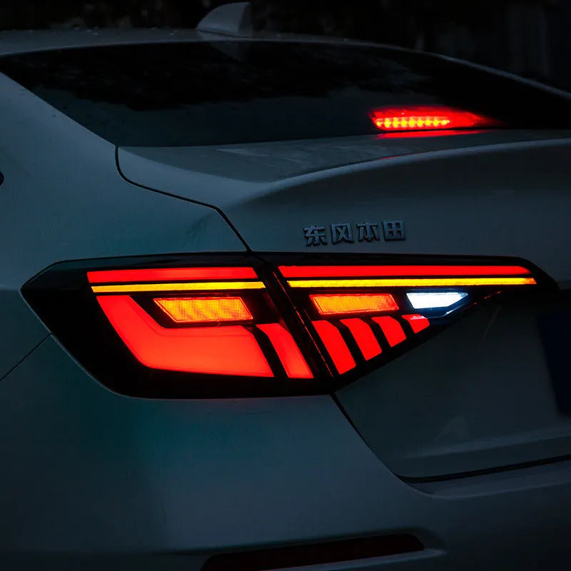 11th Generation Honda Civic black and red LED taillight assembly with streamer indicators.