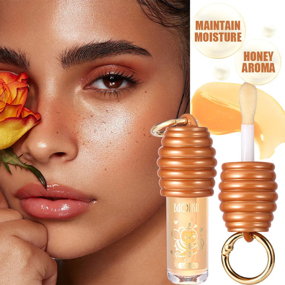 Honey Lip Gloss with keychain attached, showing portable design for bags and paniers