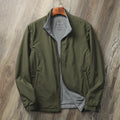 Men's stand collar casual jacket in army green, shown on a model, featuring a simple design with a cotton-lined interior.