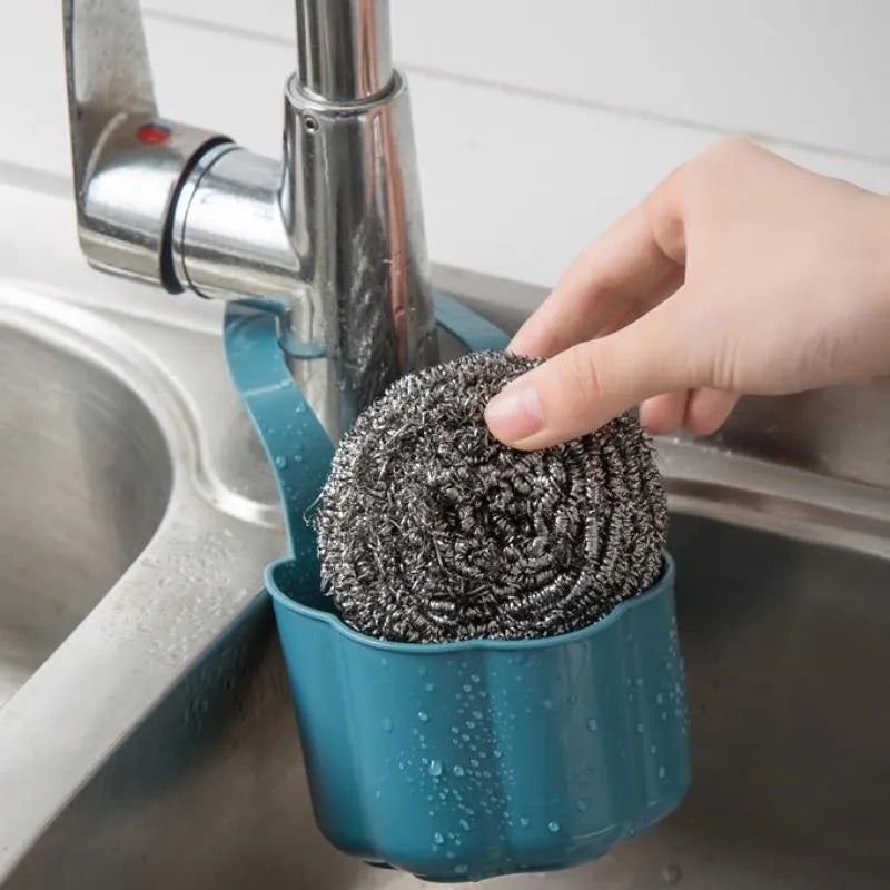 Nordic style plastic sink drain basket in dark blue on a kitchen counter
