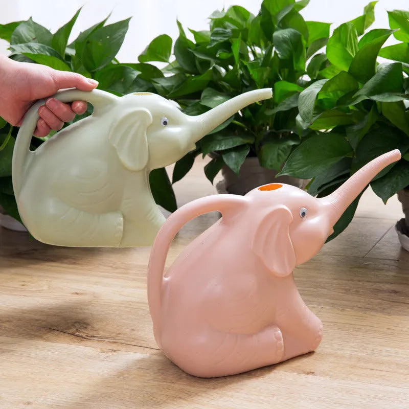 Pink elephant-shaped plastic watering can with a long nozzle for plant watering.