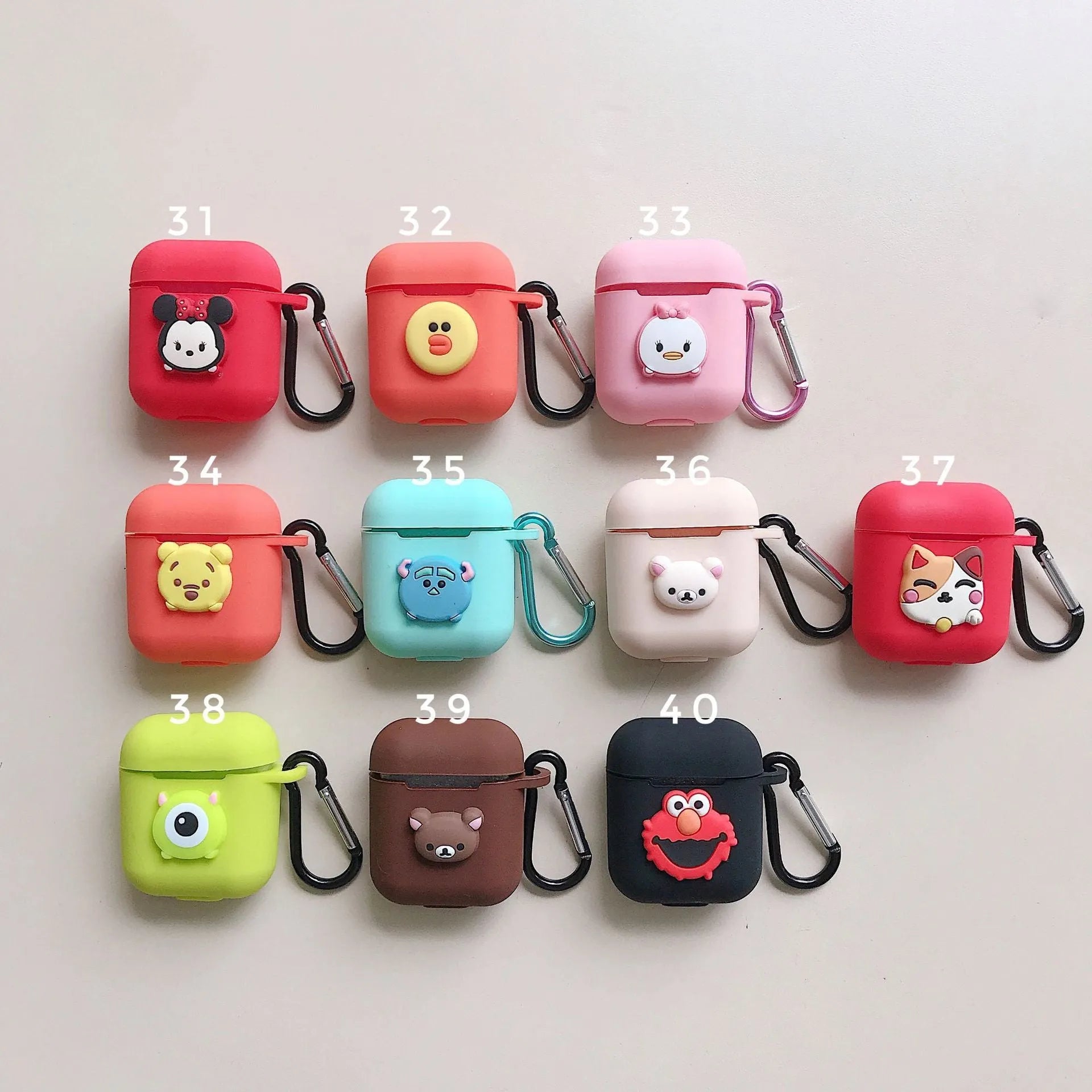 Silicone protective case for Bluetooth earphones with cartoon design and key-clasp hanging rope