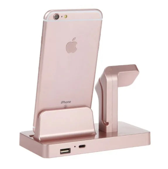 White 2 in 1 charging dock station holding an iPhone and an Apple Watch on a wooden desk.