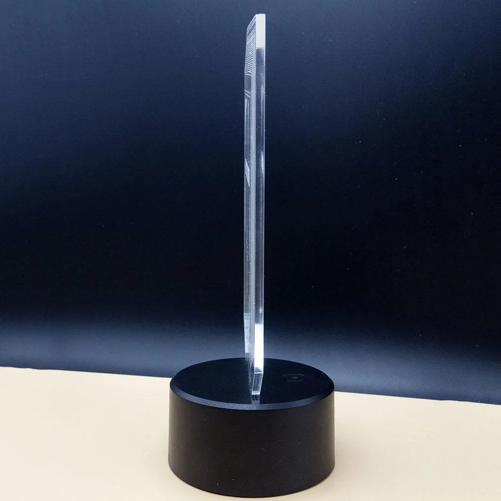 3D brain illusion LED desk lamp on stand with remote control, showing colourful light projection.