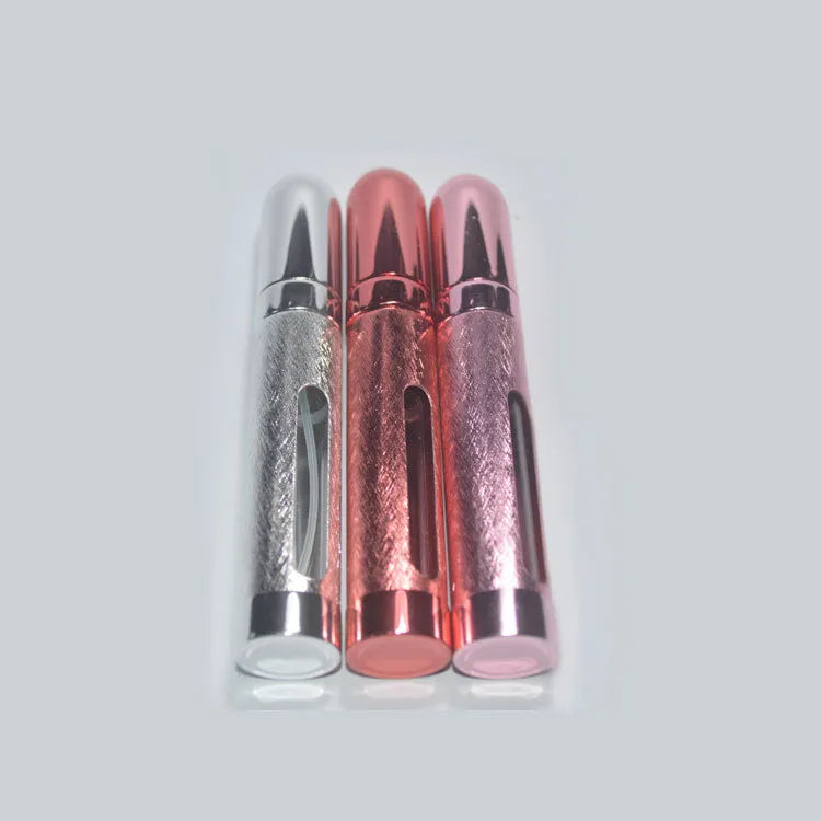 12ml aluminium portable perfume bottle atomiser in six colour options shown next to a ruler for scale.