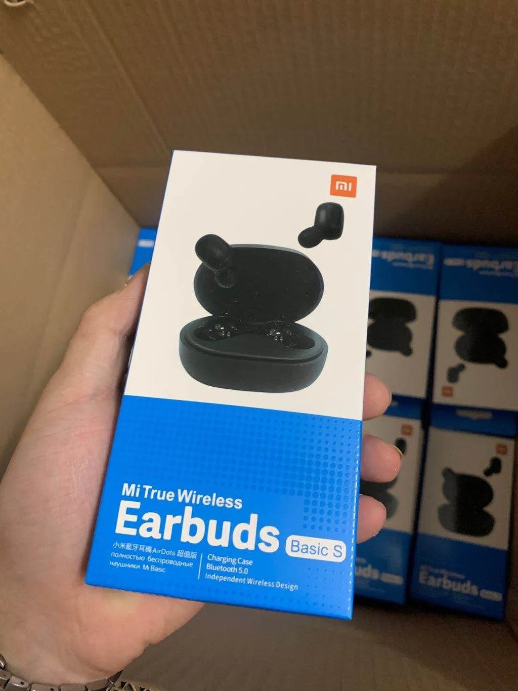 Black Redmi AirDots 2 true wireless earbuds with their compact charging case.